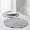 B&M Grey Round Pom Pom Placemats 4pk -B&M 355688 4pk grey round placemats with pom poms